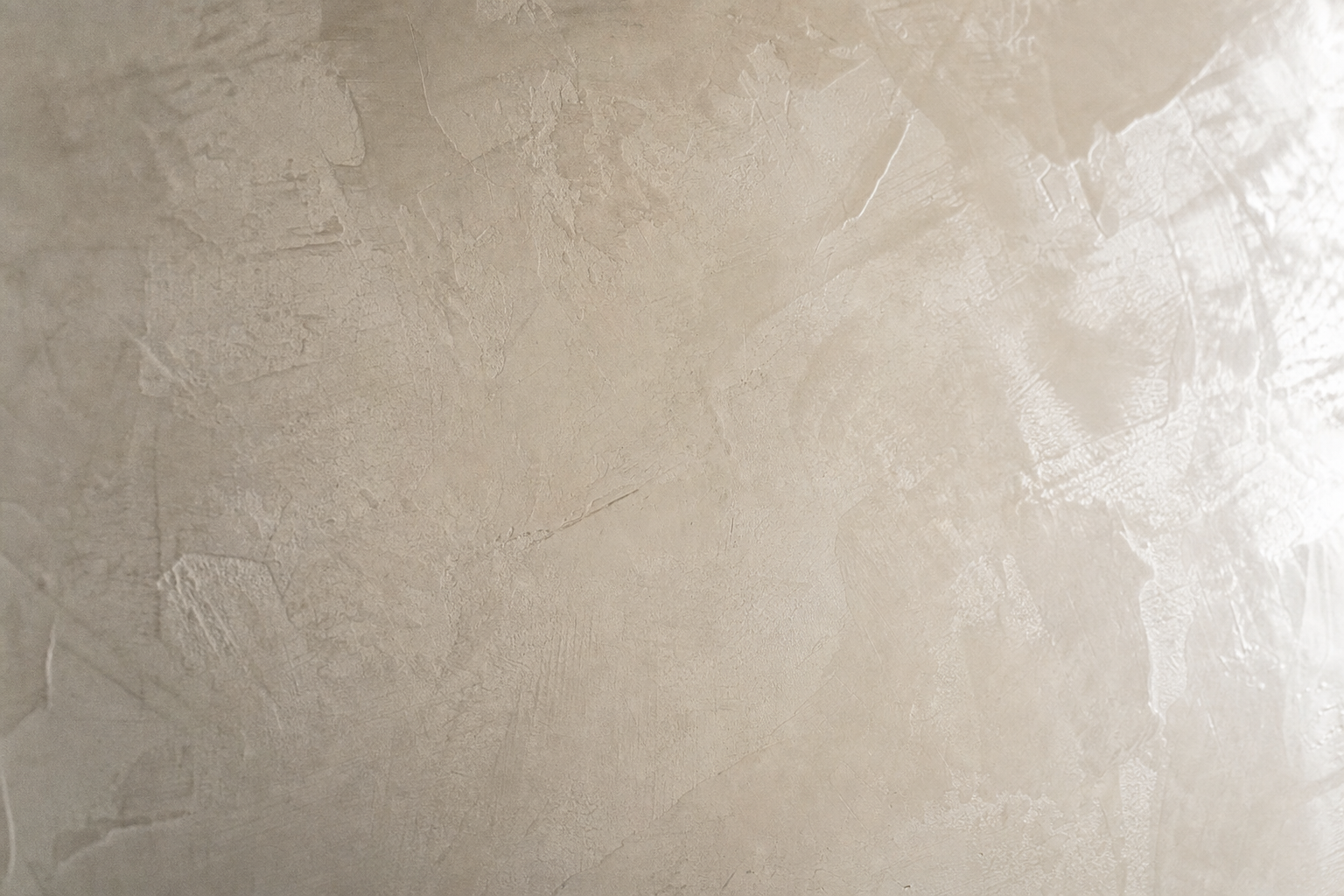 Close detail of hand-troweled Venetian plaster with a soft burnished sheen