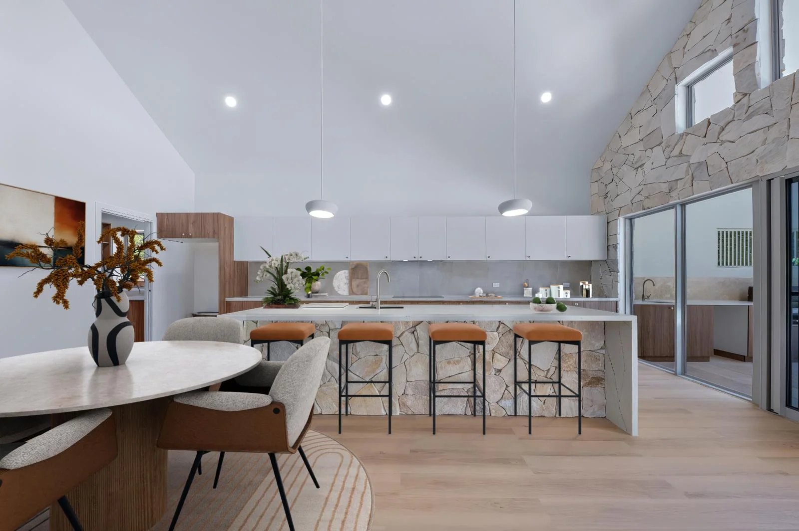 Private Hideaway Bay residence kitchen — raked timber-lined ceiling, stone-clad island and custom joinery